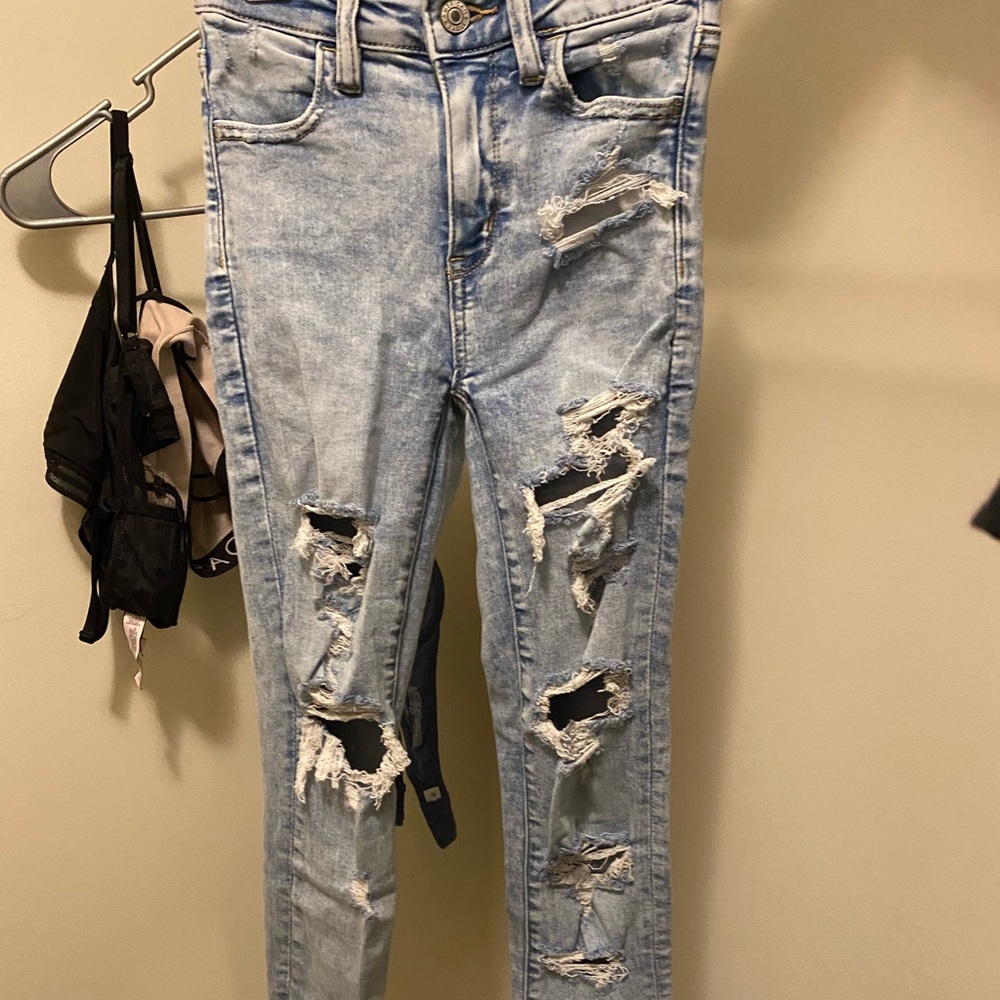 distressed high waisted blue jeans